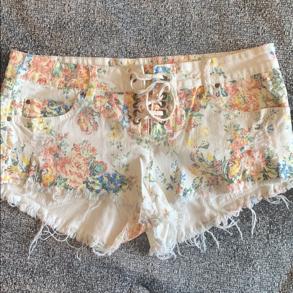 Floral print jean shorts.